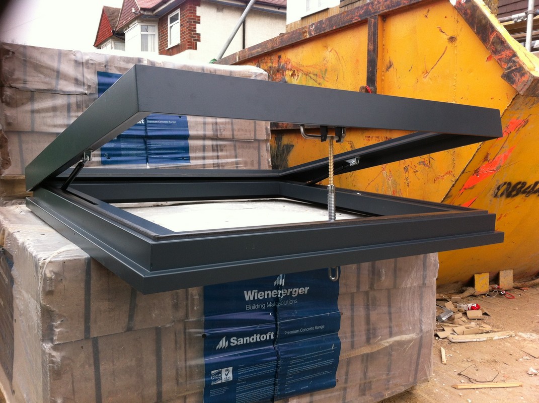 Opening flat roof skylight in anthracite grey installed in Crouch End